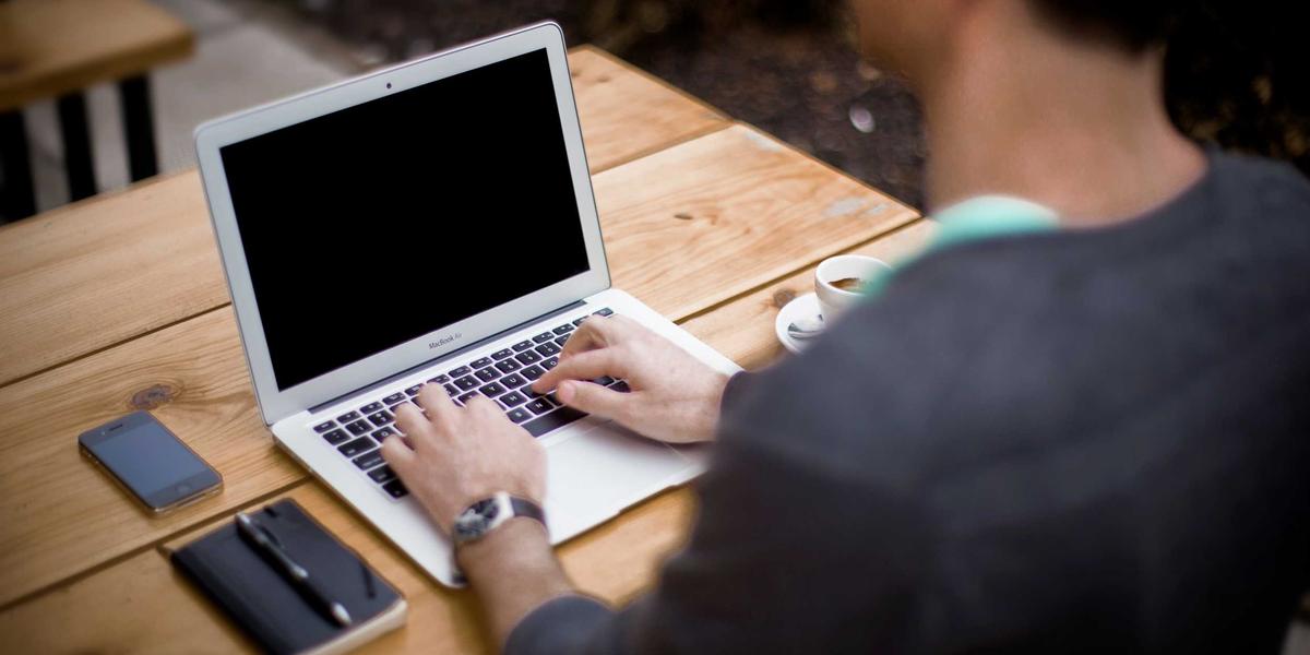 A developer working on a laptop — format and validate JSON without pasting it to a server