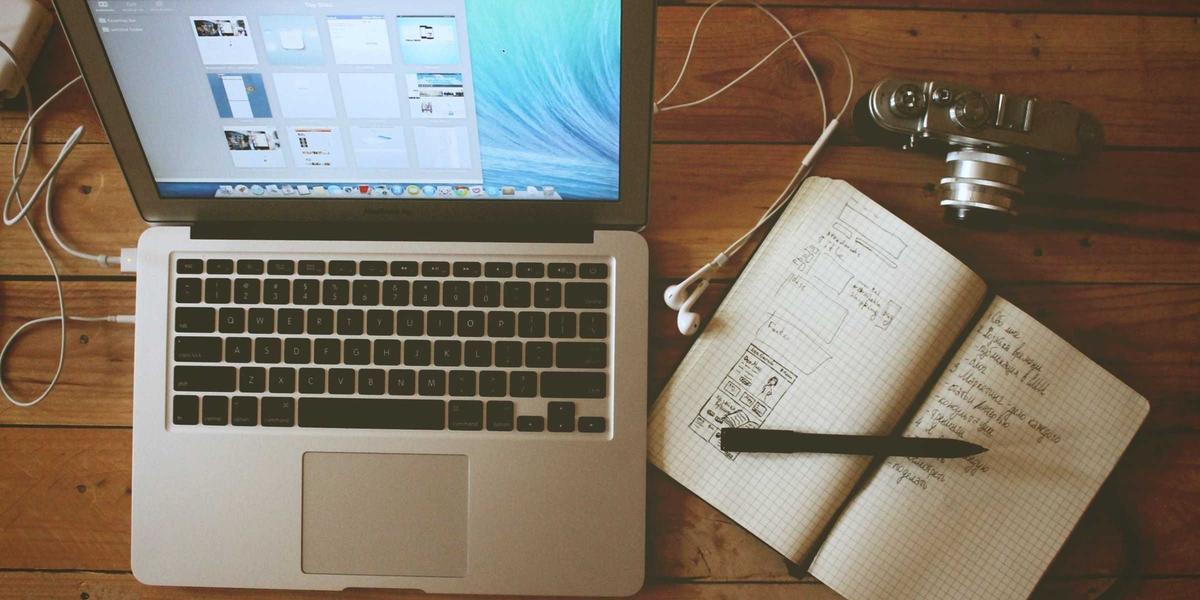 A laptop and notebook workspace — free online tools trade files and attention for convenience